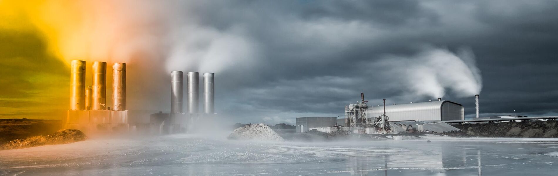 Offshore oil and gas industry with piping and valves, worker in foreground